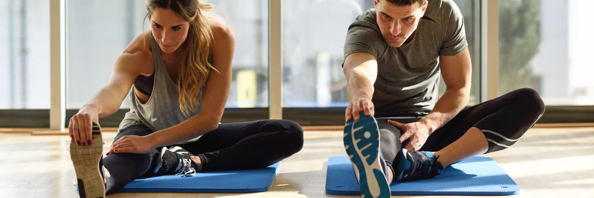 Couple stretching while wearing crossfit socks