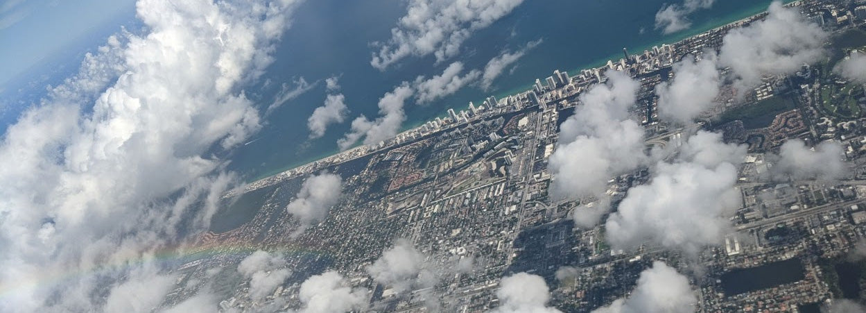 View from a plane over a coastal city.