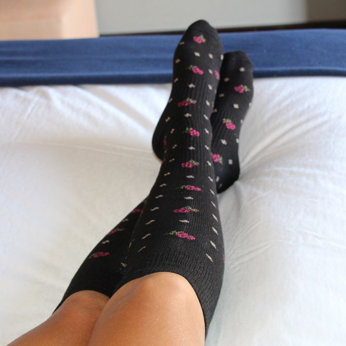 Athlete relaxing in their Sox Solution over the calf socks.
